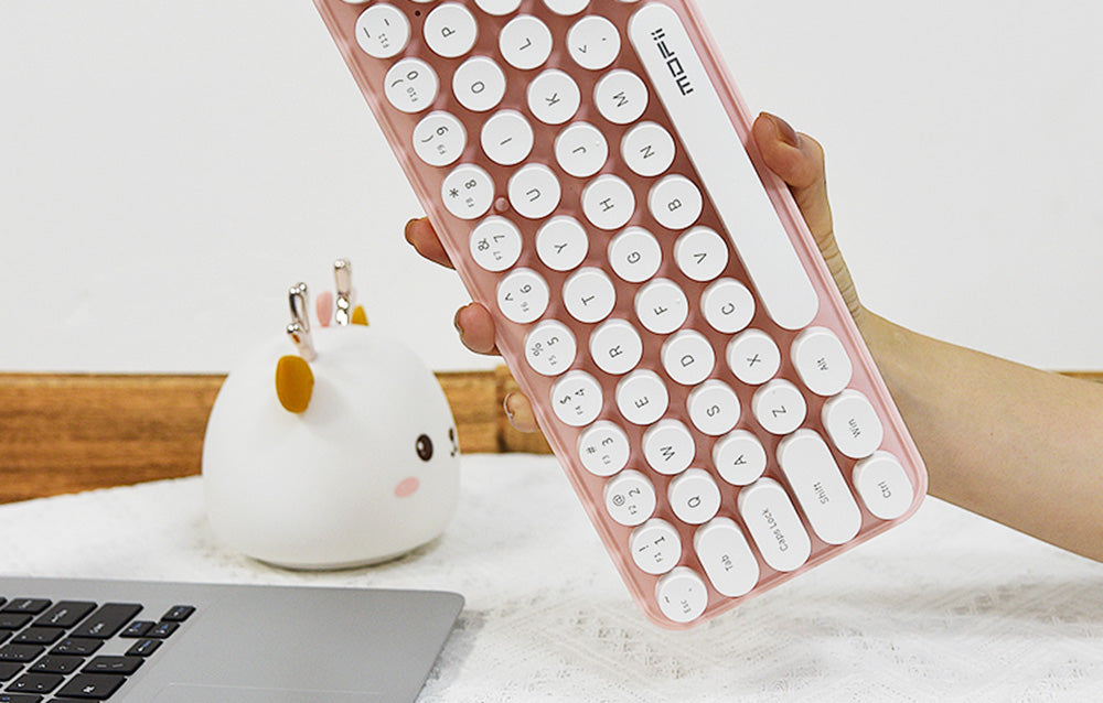 MOFII SMK-676367AG wireless keyboard pink white with FN multimedia shortcut keys, side profile view
