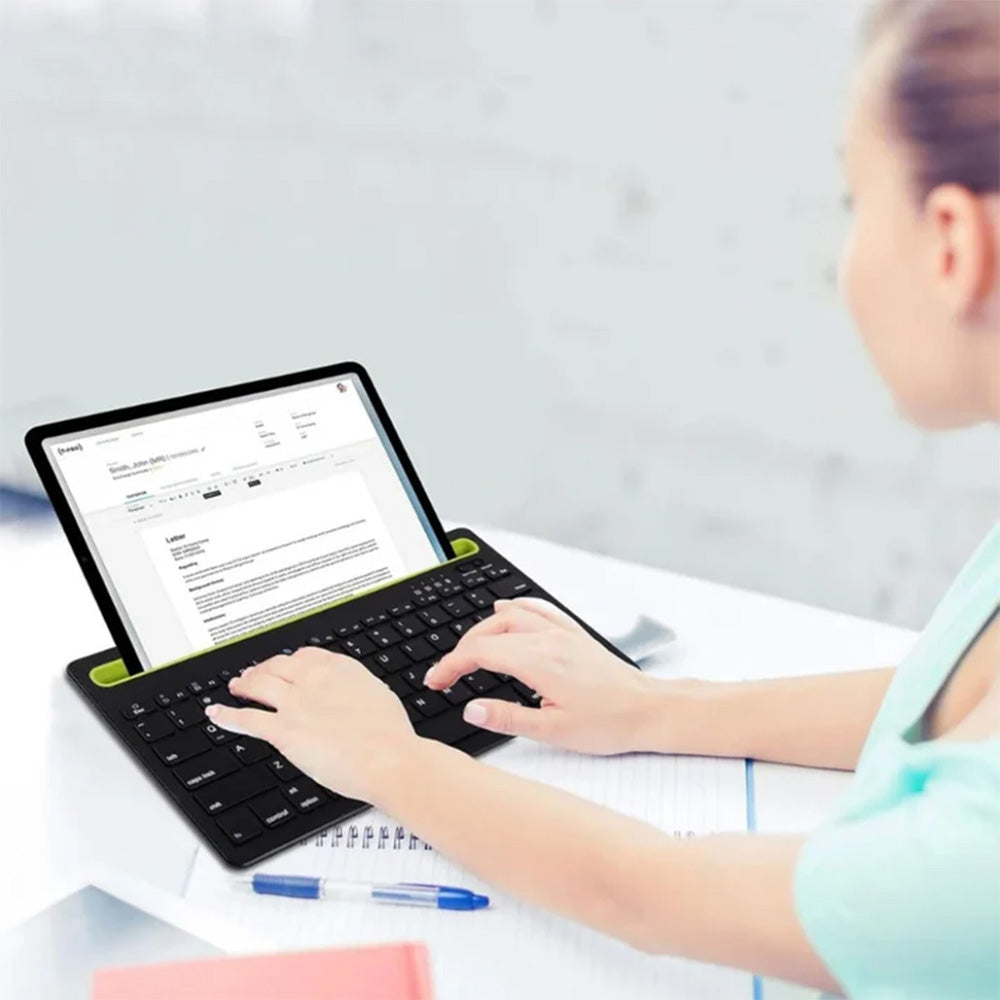 Coteci OF-034 keyboard holding tablet in slot for multitasking.
