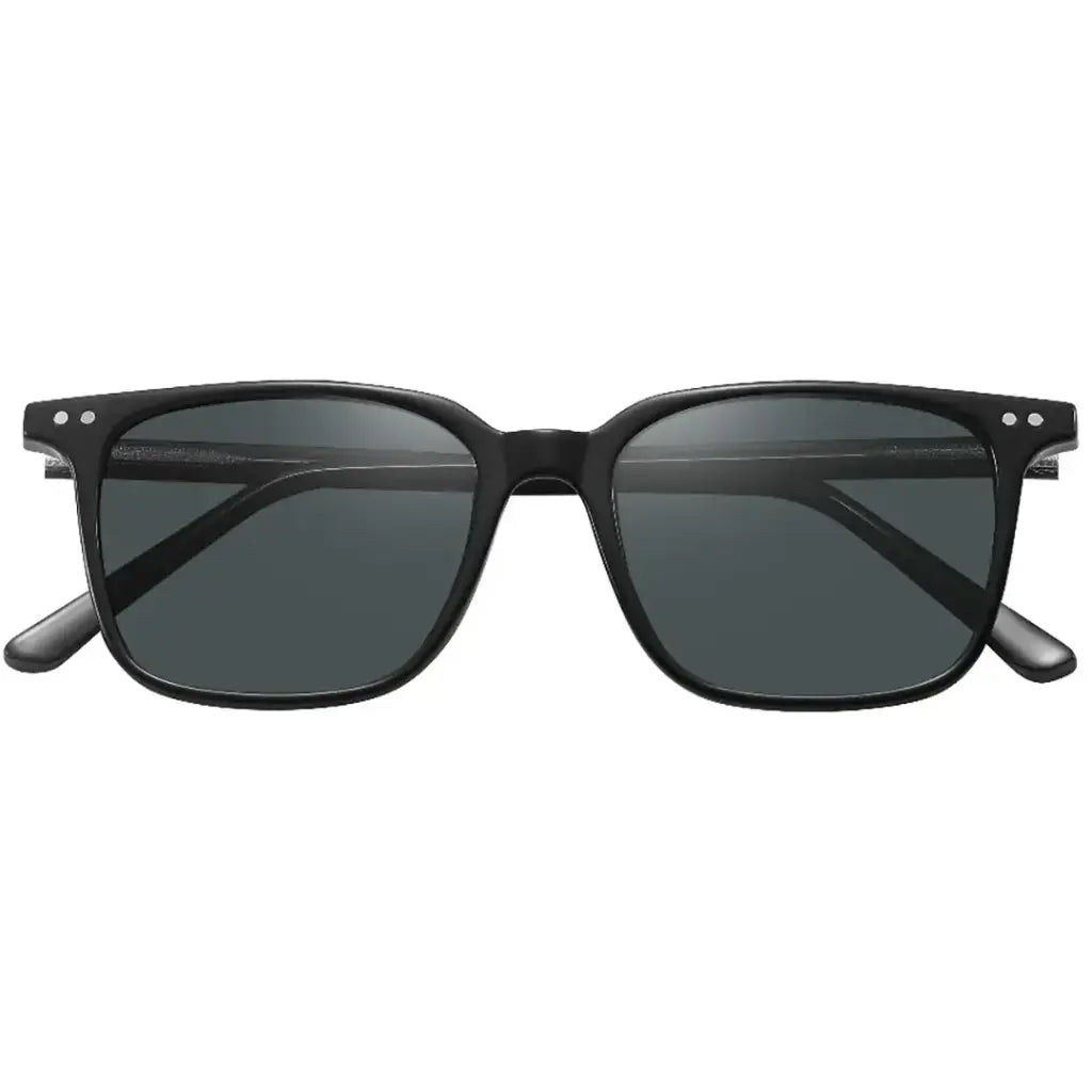 Green Lion sunglasses worn outdoors in sunlight
