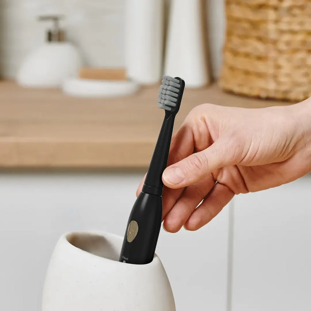 Green Lion toothbrush with replaceable brush heads and sleek design
