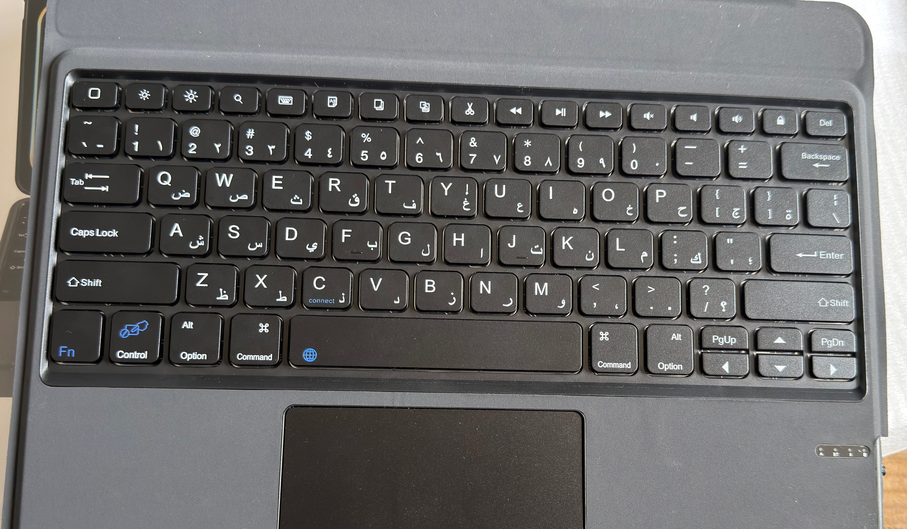 iPad flip keyboard case fully closed showing PU leather exterior with precise camera and port cutouts
