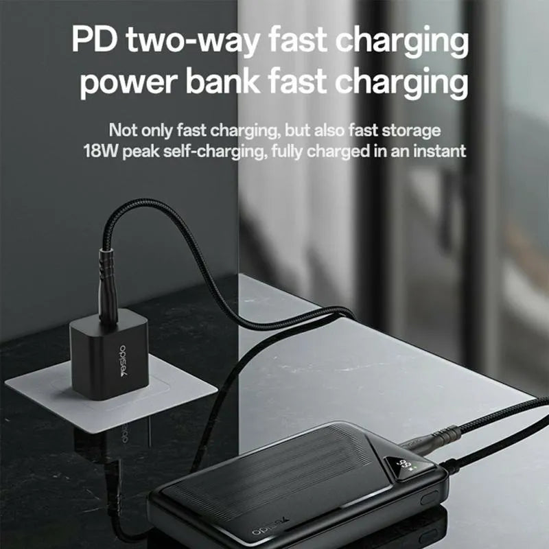 High-capacity YESIDO YP83 power bank charging smartphone.
