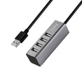 HOCO HB1 USB hub with 4 USB ports connected to laptop
