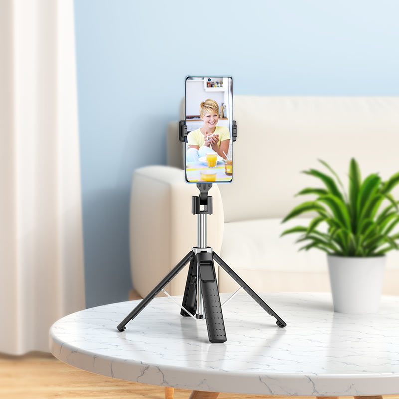 Portable HOCO K18 tripod folded for travel use.
