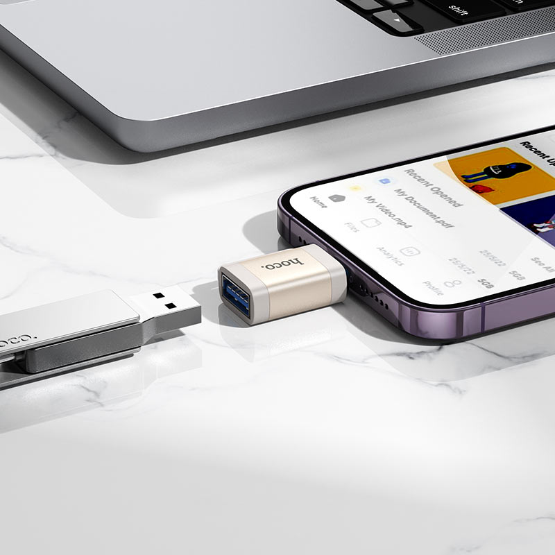 HOCO Lightning to USB-A OTG adapter connected to iPhone