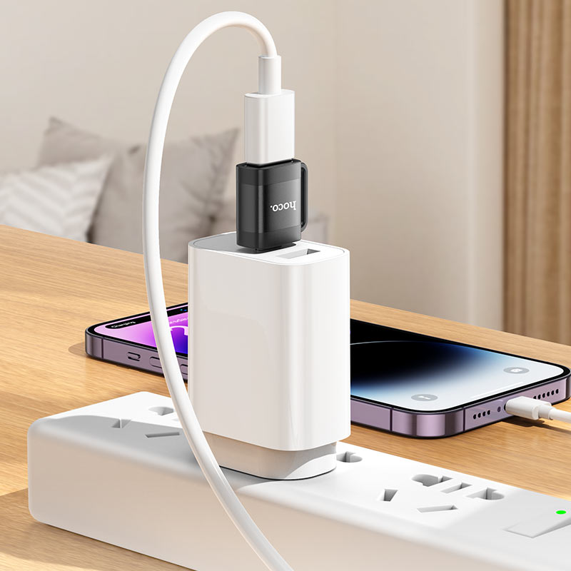 HOCO USB-C OTG adapter plugged into phone and USB device