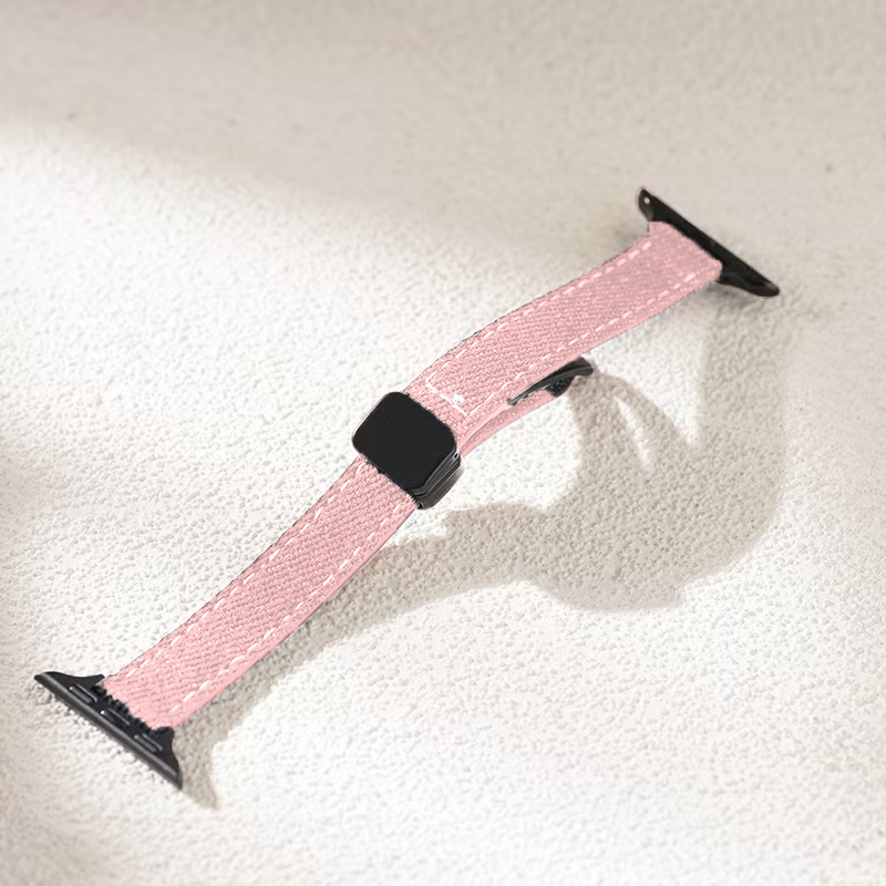 Slim leather denim Apple Watch band pink color on surface