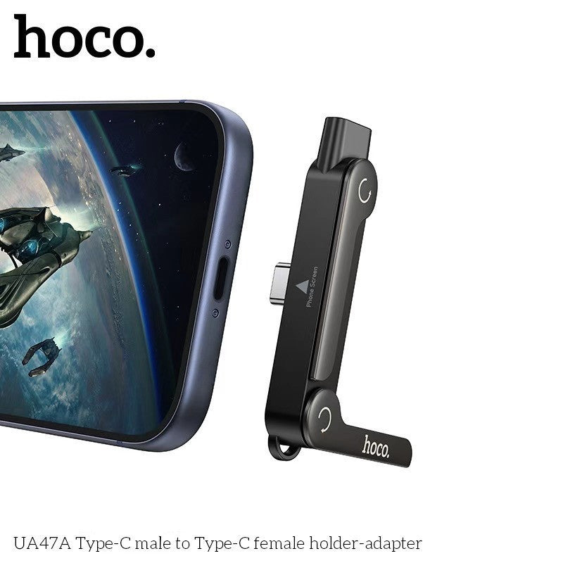 HOCO UA47 adapter with built-in phone holder and USB-C charging ports.
