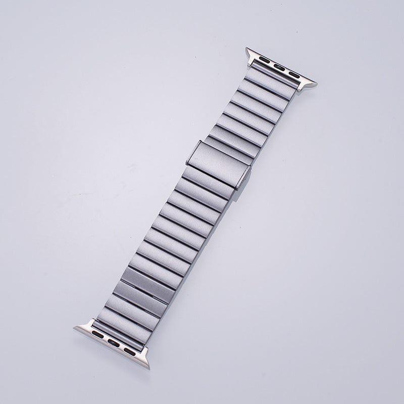 Spigen Modern Fit stainless steel Apple Watch band in silver, full length view showing link bracelet design on light background
